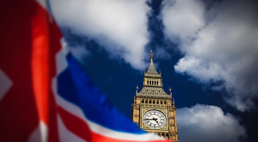 double exposure of flag and Westminster Palace with Big Ben