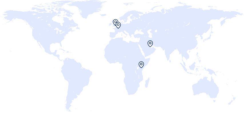 World map showing five location markers. Two markers are clustered in north-western Europe around the United Kingdom and northern France. Three additional markers are located in the Middle East (Doha) and Nairobi. The map uses a light blue background for land masses and dark blue pin icons to indicate locations.